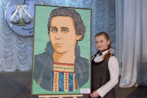 Anna Cherkasenko and her competition work - a portrait of Lesya Ukrainka, made of plasticine